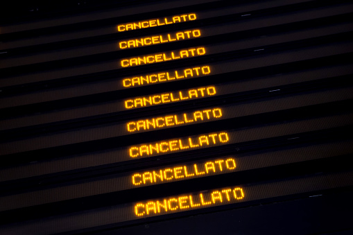 Milan, Italy - November 6, 2015: Timetable shows cancelled trains at the Milano Porta Garibaldi railway station in Milan, Lombardy, Italy, during the one-day rail strike in Northern Italy on November 6, 2015.