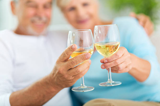 istock Senior couple drinking wine 613518472