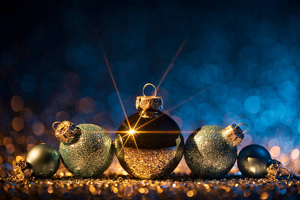 istock Christmas ornaments on defocused lights. Decorations Bokeh Blue Gold 613518514