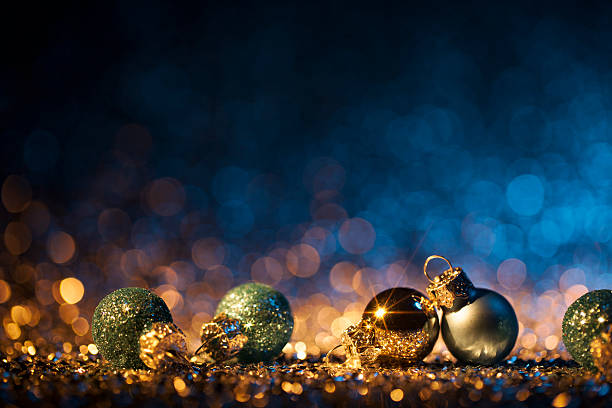 istock Christmas ornaments on defocused lights. Decorations Bokeh Blue Gold 613518692