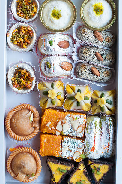 istock Indian sweets or mithai in a gift box 613519900
