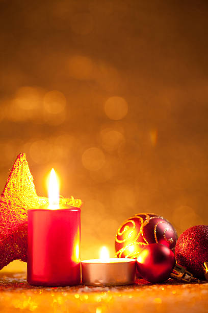 istock Candles and baubles on glitter with gold background 613521792