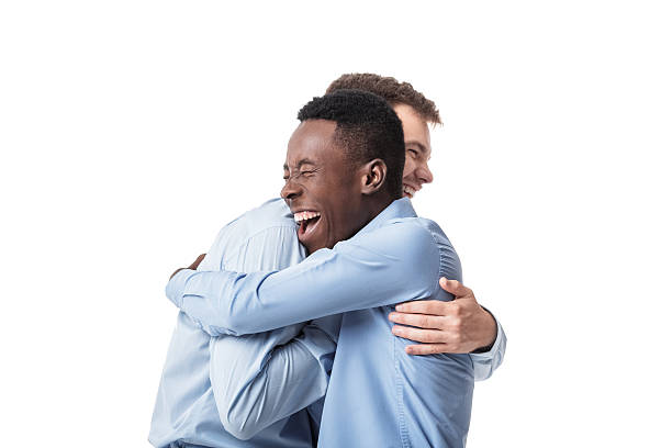 hombres de negocios felices abrazando - photography people two people male fotografías e imágenes de stock