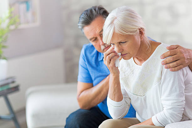 istock Senior Man Consoling Wife 613522340