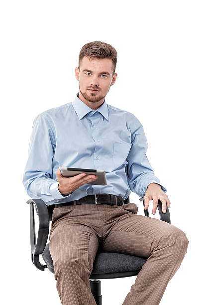 businessman  sitting in  chair and using tablet - suit male beauty men businessman imagens e fotografias de stock