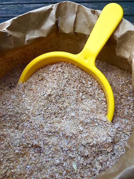 istock Wheat bran with a yellow shovel 613523840