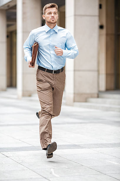 istock businessman with  briefcase running 613524216