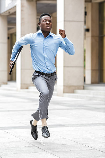 istock businessman with briefcase running 613524360