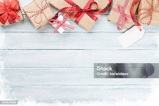 Christmas Wooden Background With Gift Boxes And Snow Stock Photo - Download Image Now