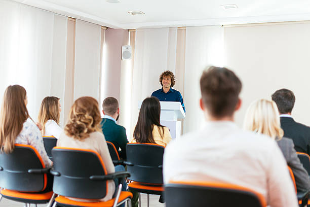 istock Young life coach speaks on the conference 613526336