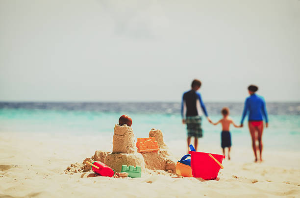istock sand castle on tropical beach, family vacation 613527232