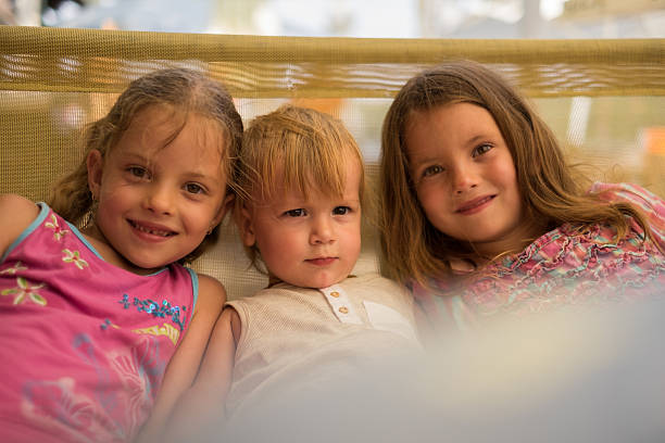 istock young boy with girls 613528356
