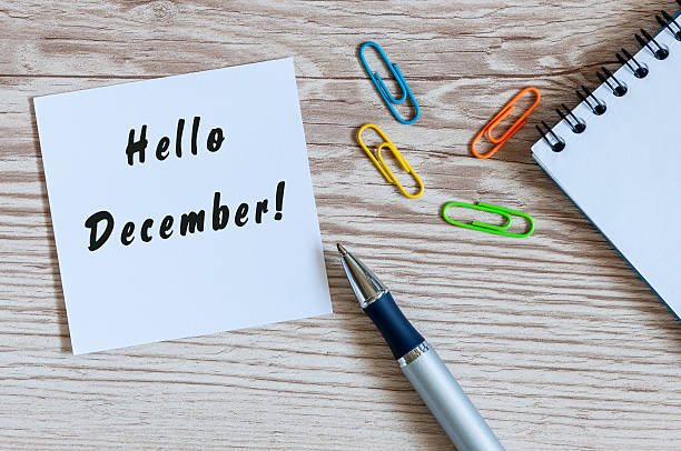 istock Hello December written on paper at work table. Eve, Christmas 613528928