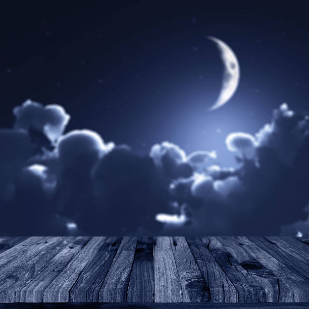 istock 3D Halloween background with wooden deck and night sky 613530254