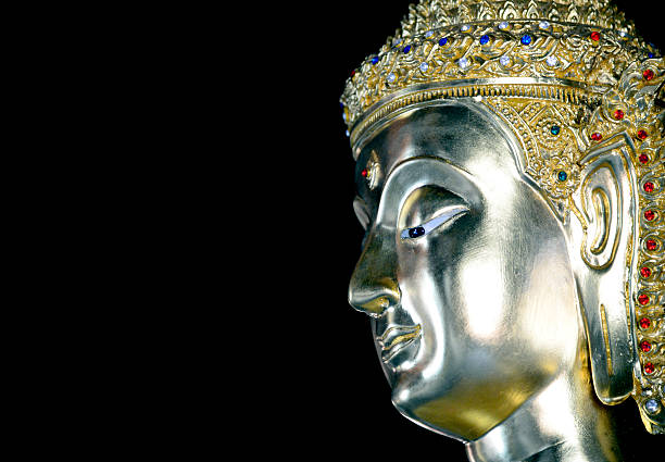 istock buddha statue isolated,statue in Buddhist Thailand temple or wat 613530610