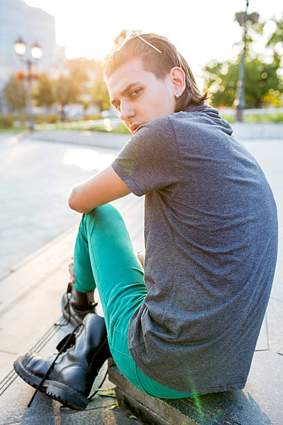 istock Young man sulking and looking at camera. 613531314