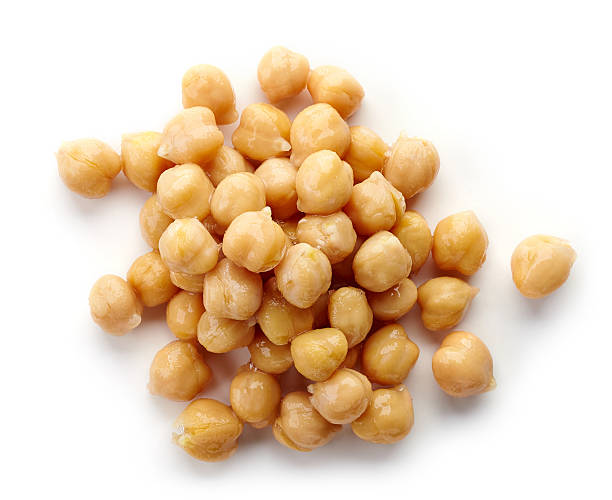 Heap of chickpeas isolated on white, from above Heap of preserved chickpeas isolated on white background, top view chick pea photos stock pictures, royalty-free photos & images
