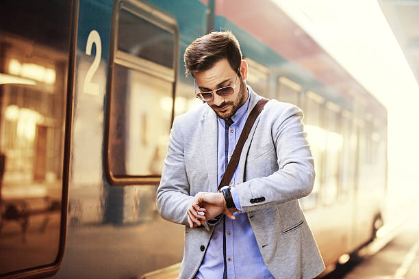 istock Businessman on railroad station 613535402