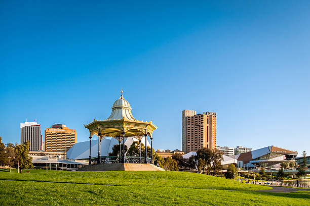 A view across the River Torrens in Elder Park, towards Adelaide's business, hotel and civic buildings.