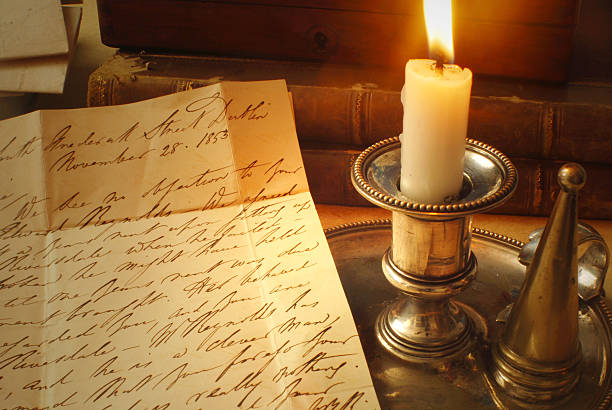 Victorian Letter with Candle Reading Correspondence from the 1800's by Candle light english culture photos stock pictures, royalty-free photos & images