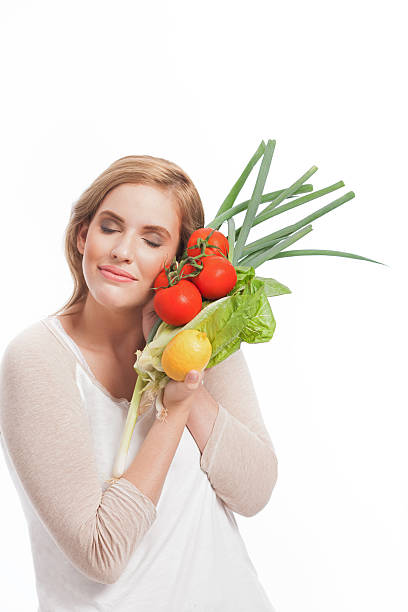 istock Beautiful woman with vegetables. 613536720