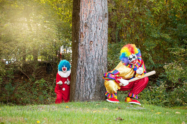 istock Creepy Clowns Luring People Into Woods 613537552