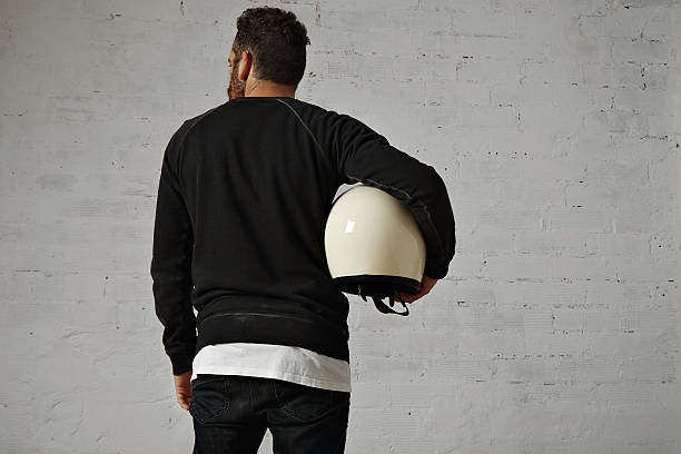istock Young man with motorcycle helmet 613538022
