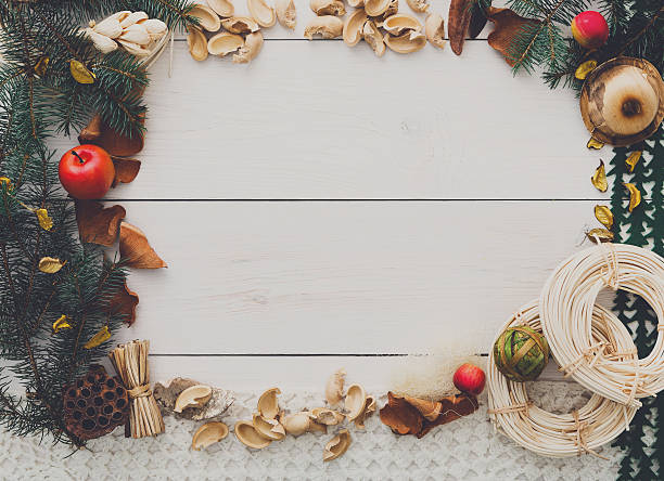 istock Christmas decoration handmade frame on white wood background copy space 613539628