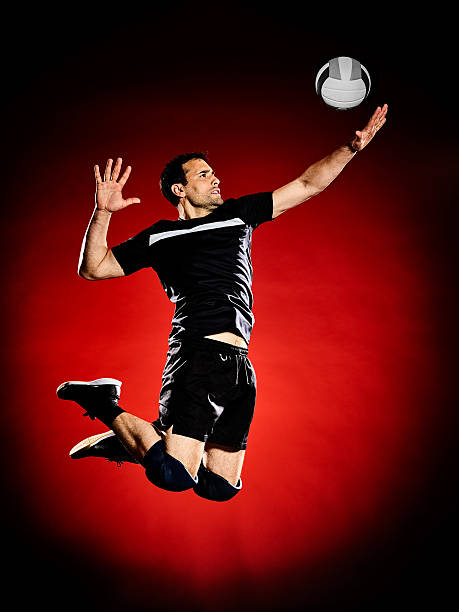 volley ball player man isolated one caucasian volley ball player man isolated on colorful black background male volleyball player stock pictures, royalty-free photos & images
