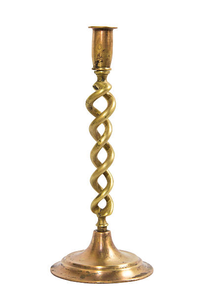 istock Old brass spiral candlestick  on white background 613539826