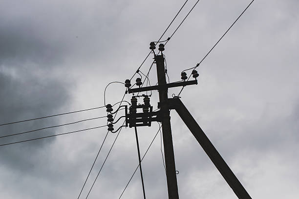 istock High voltage pillars on the background of cloudy sky 613541374