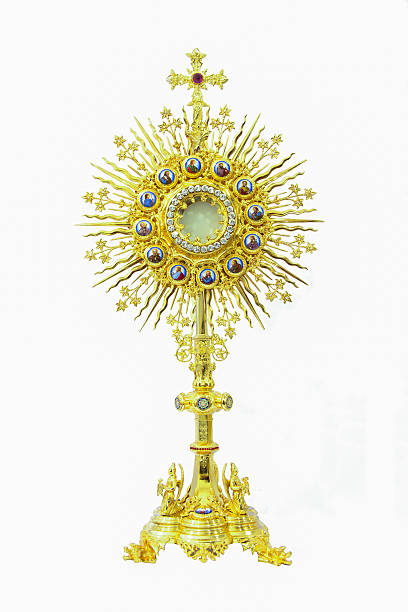 Old gold monstrance on white background