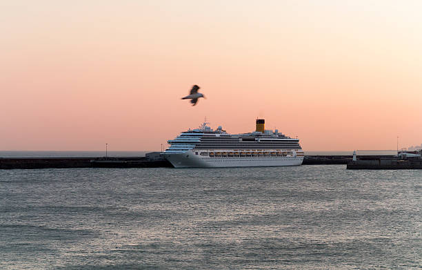 Dover, England - September 10, 2015: Cruise ship moored at the port of Dover in dusk