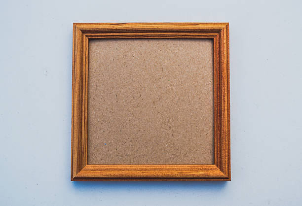 istock Old wooden frame on the background of the table 613542050