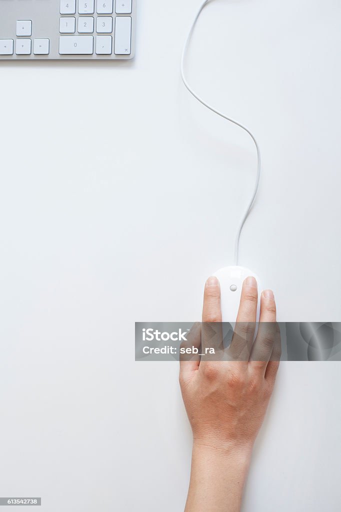 Woman hand on mouse Computer Mouse Stock Photo