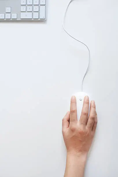 Photo of Woman hand on mouse