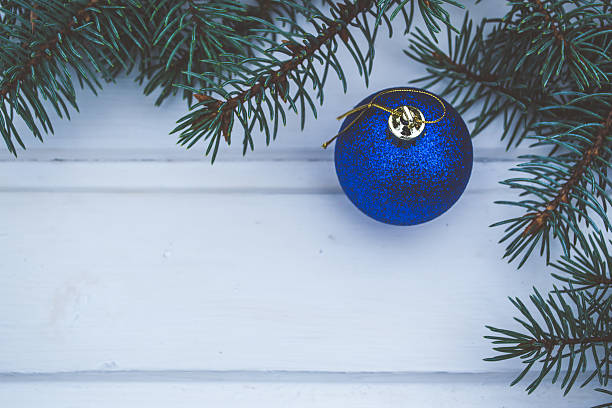 istock Christmas ornaments on old wooden table 613543794