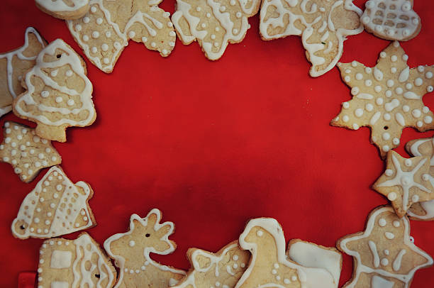 istock Gingerbread cookies on the red board, Chrismas background, 613544550