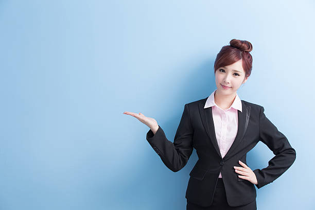 istock business woman show something 613546248