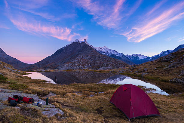 istock High altitude alpine lake, reflections at sunset 613546572