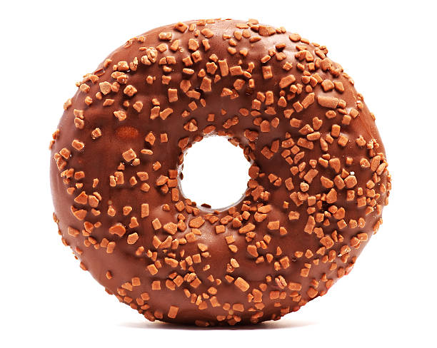 istock Donut with sprinkles on white background. Brown Chocolate donut 613546900