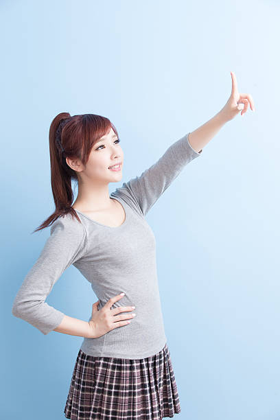 istock beauty girl student show something 613547440