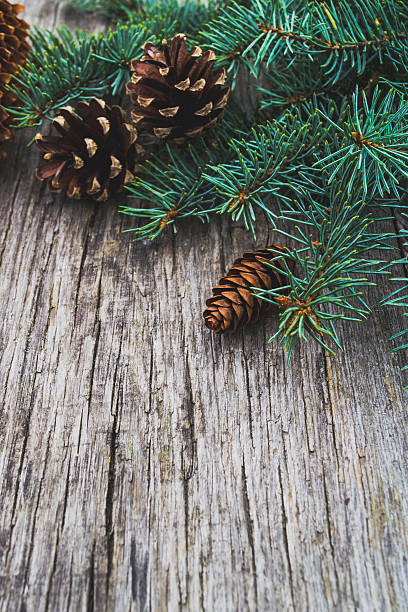 istock Christmas ornaments on old wooden table 613548096
