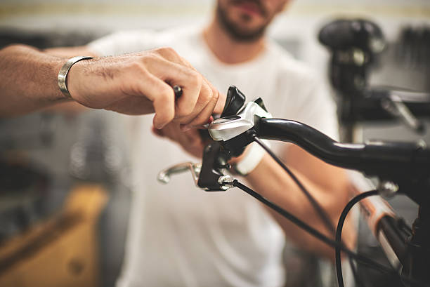 istock Mechanic in bicycle store 613548590