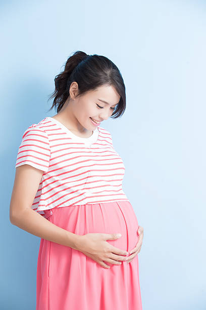 istock pregnant woman is smile 613550054
