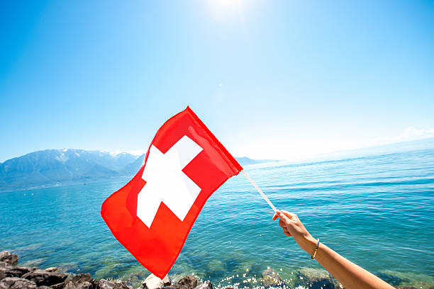 istock Swiss flag on the lake background 613550118
