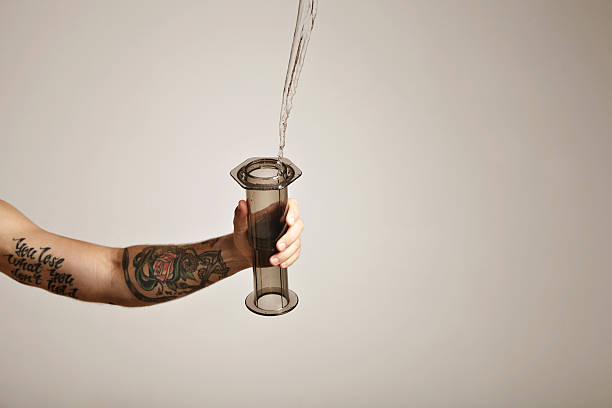 istock Water poured into aeropress 613550384