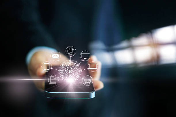 istock Man using mobile payments, holding circle global and icon customer 613550706