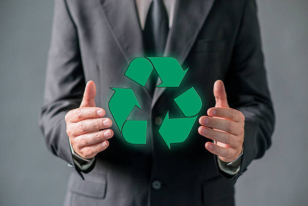 istock Handsome businessman pressing virtual  green recycling icon 613551482