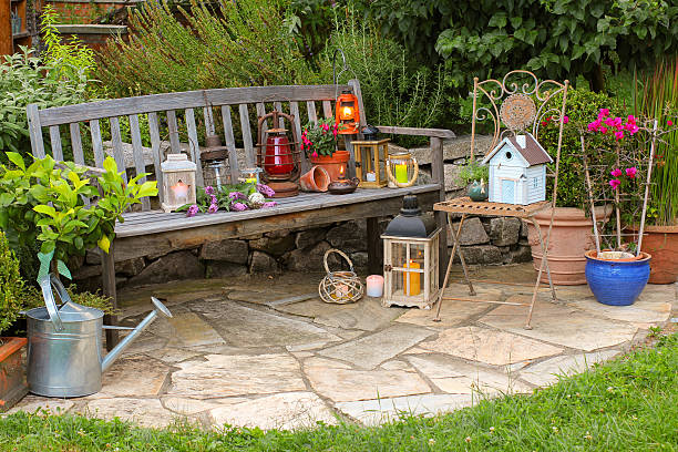 istock Idyllic garden place with different lanterns 613551670